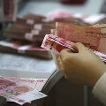 Китайский ЦБ задумал завалить мир юанями